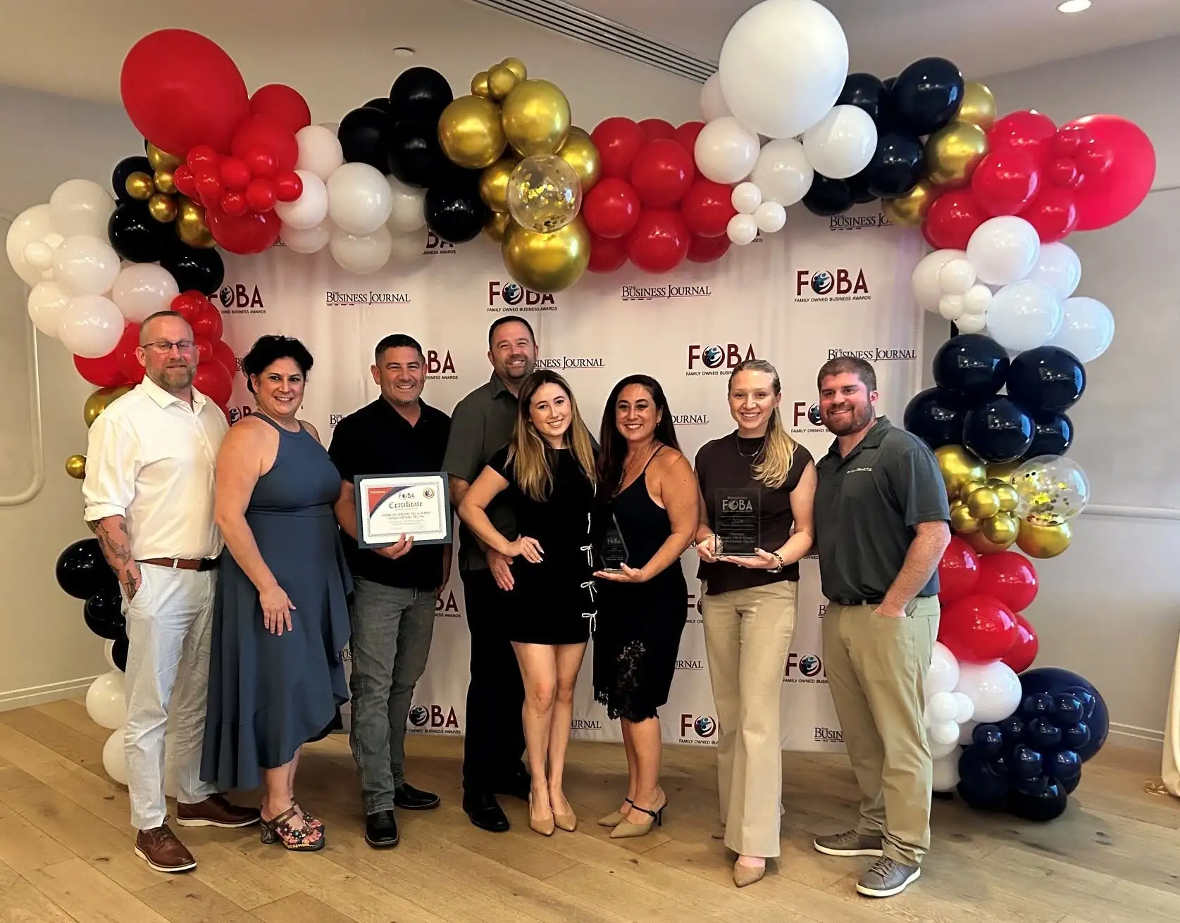 American Ceramic Tile & Supply and Visalia Ceramic tile representatives holding award