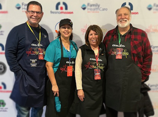 Fresno team members volunteering for a non-profit food support organization.