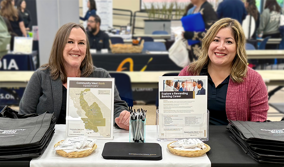 Teresa and Joanne from human resources at a job fair booth.