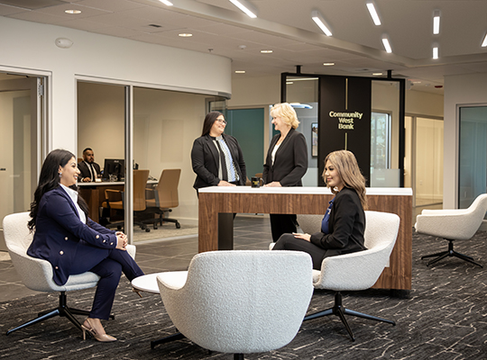 Group of team members having a conversation in the office