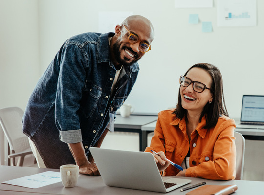 Two people smiling 